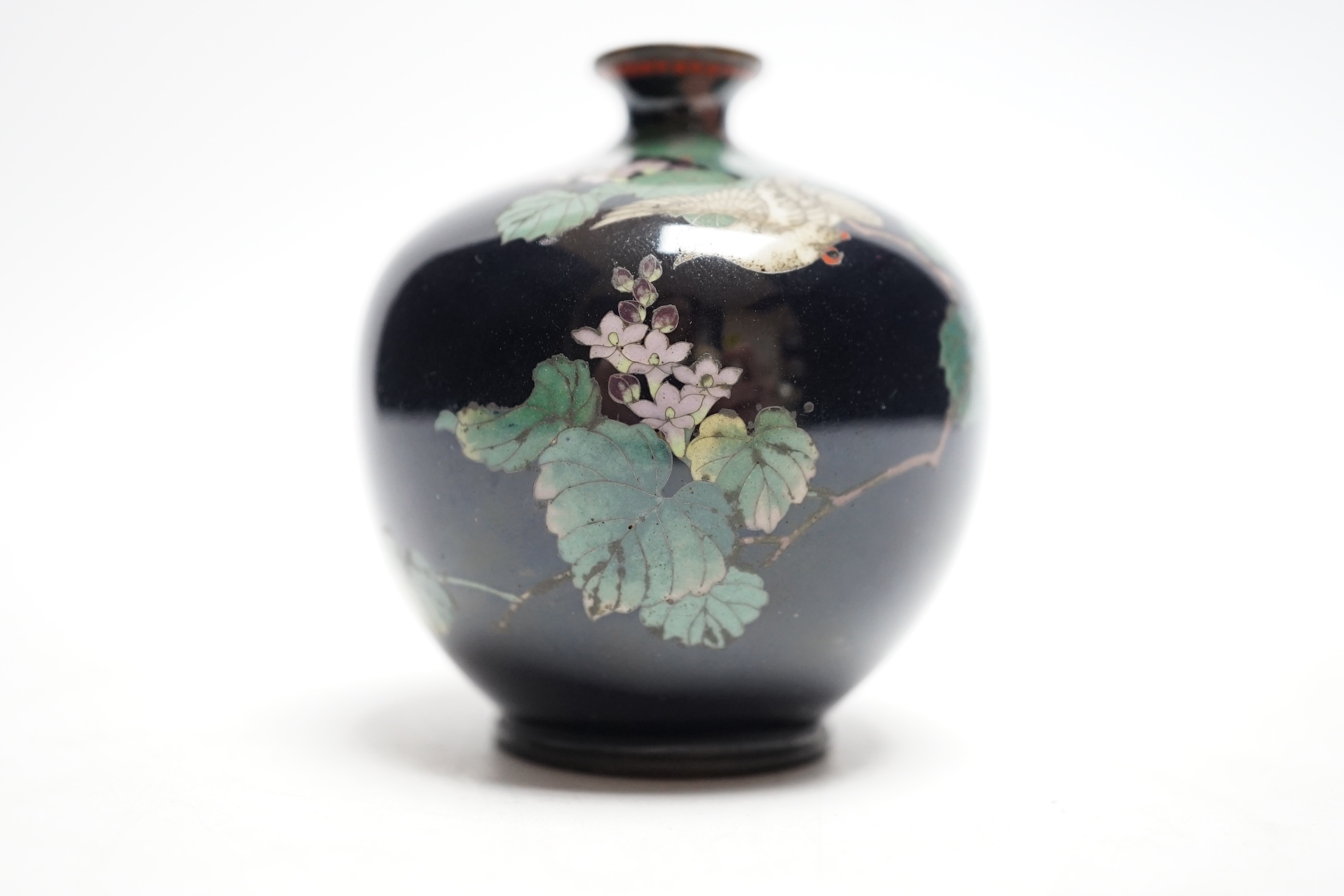 A Japanese silver wire cloisonné enamel miniature globular vase, Meiji period, decorated with a dove amid flowering branches, 6.5cm high